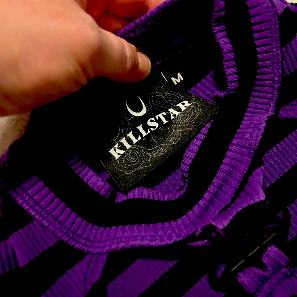 Killstar top with keyhole cutout and pentagram hardware.
